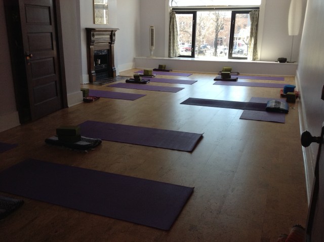 Photo of studio with mats laid out.